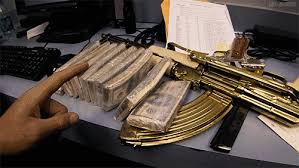 smoking_guns_and_lot_of_money.jpg