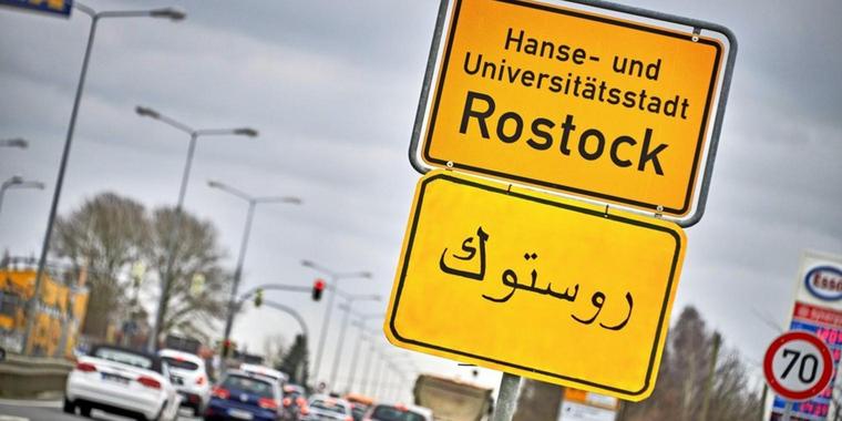 ortsschilder-mit-arabischen-schriftzeichen-in-....jpg
