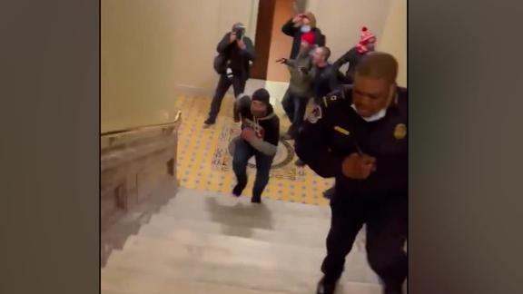 210106221648-capitol-officer-runs-pro-trump-....jpg