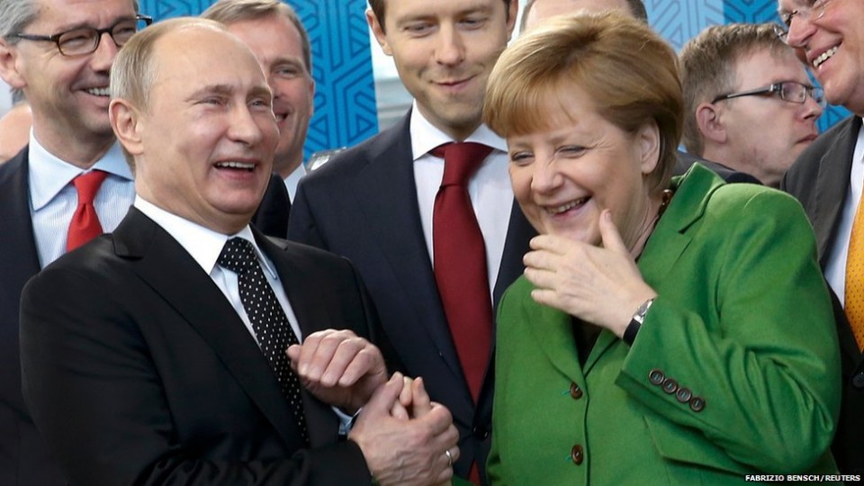 russian-president-vladimir-putin-laughs-with-....jpg